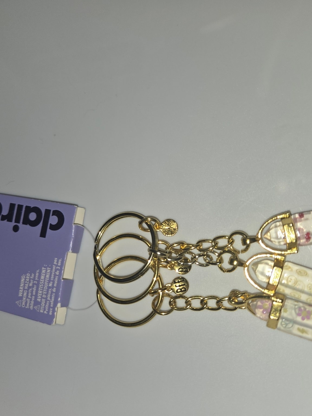 Gold Tone Floral Keyrings Set And Cosmic Bracelets